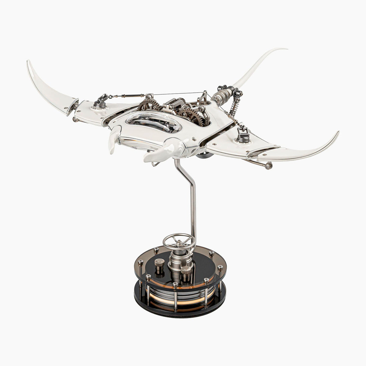 Mecha Ray White — motorised manta with wings swept wide and the gear train visible along its back, on a weighted drive base, kinetic metal sculpture by IFL Watches.