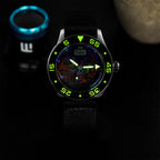 ESKA Amphibian Cœur de Paris — Lume shot in the dark, the dial markers glowing above the hand-painted Parisian cityscape on a 40mm steel diver, customized limited edition by IFL Watches.