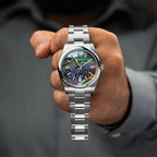 Apex Concept — Custom hand-painted racing dial held in the hand, blue machine cornering across gray asphalt, a bespoke timepiece by IFL Watches.