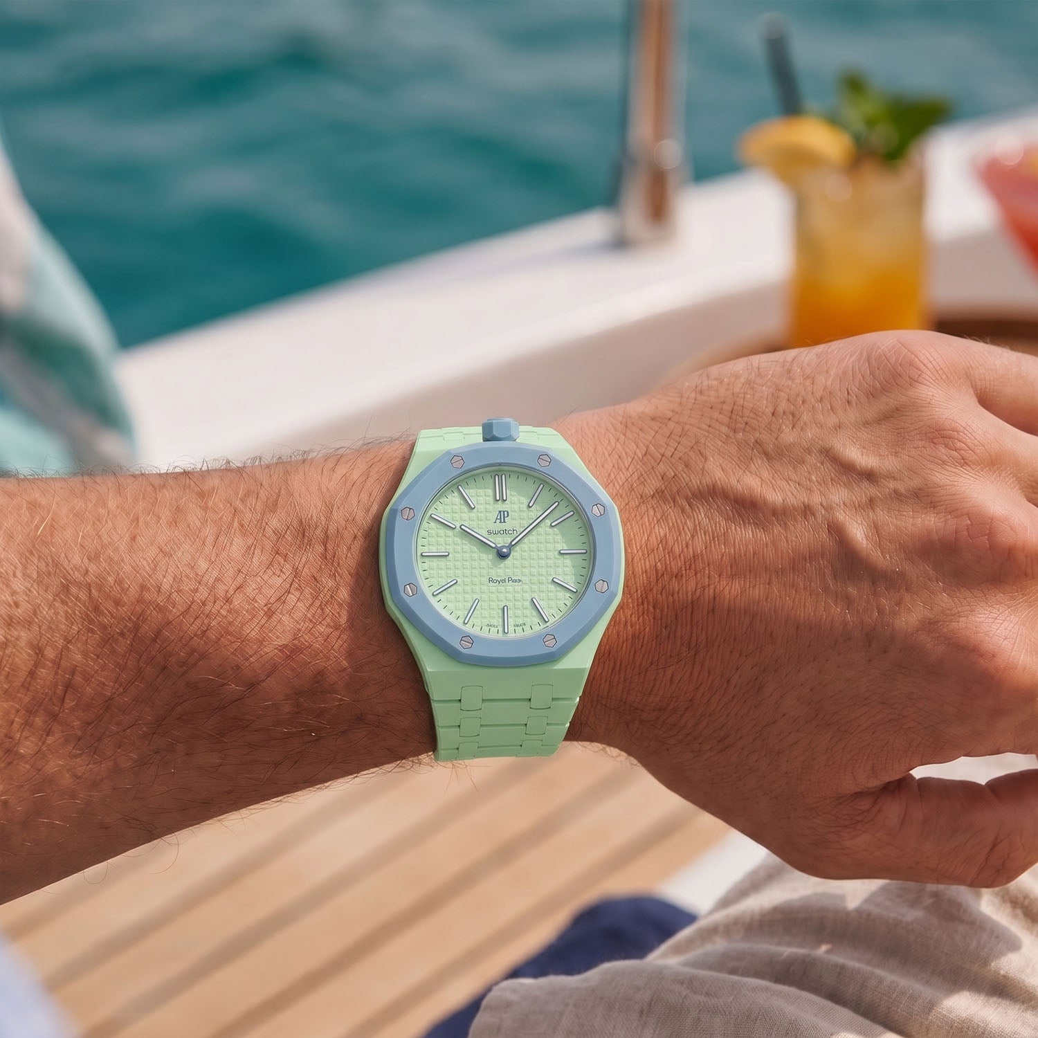 Blaue Acht Swatch × AP Royal Pop Ceramic Case-Strap — worn on the wrist on a yacht with cocktails, by IFL Watches