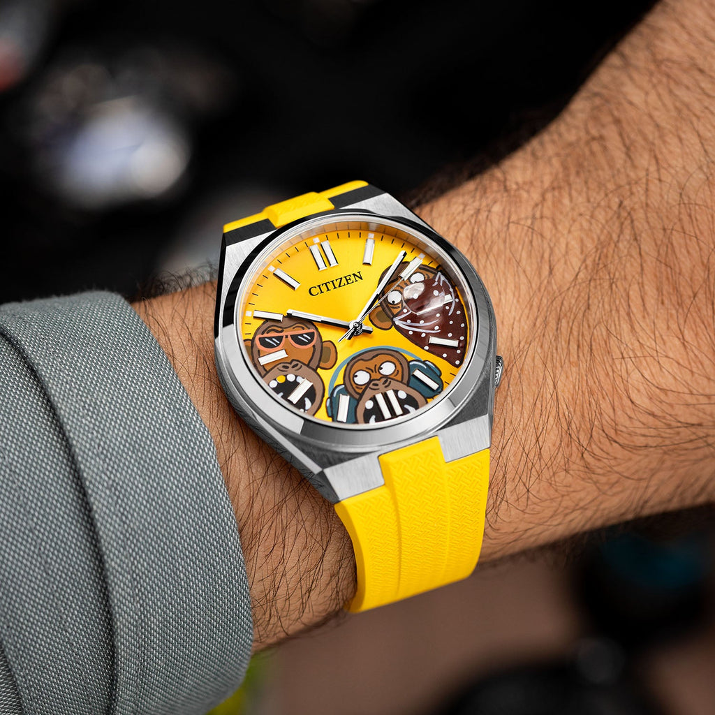 Citizen Tsuyosa Strap – Yellow FKM strap shown at an angle on the wrist with the hand-painted Wise Guys Concept by IFL Watches
