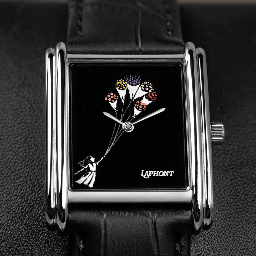 Laphont Bloc Bouquella — Close-up of the hand-painted girl holding the strings of her bouquets, the hands turning at the centre of the glossy black dial inside the stepped steel case, a custom limited edition watch by IFL Watches