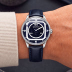 Mandetbrote Orbital II Blue — Worn on wrist with a cream cuff, showing the hour rail and minute display, available at IFL Watches.