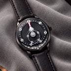 Mandetbrote Orbital Midnight Black — Resting on grey velvet, showing the white hour disc, available at IFL Watches.