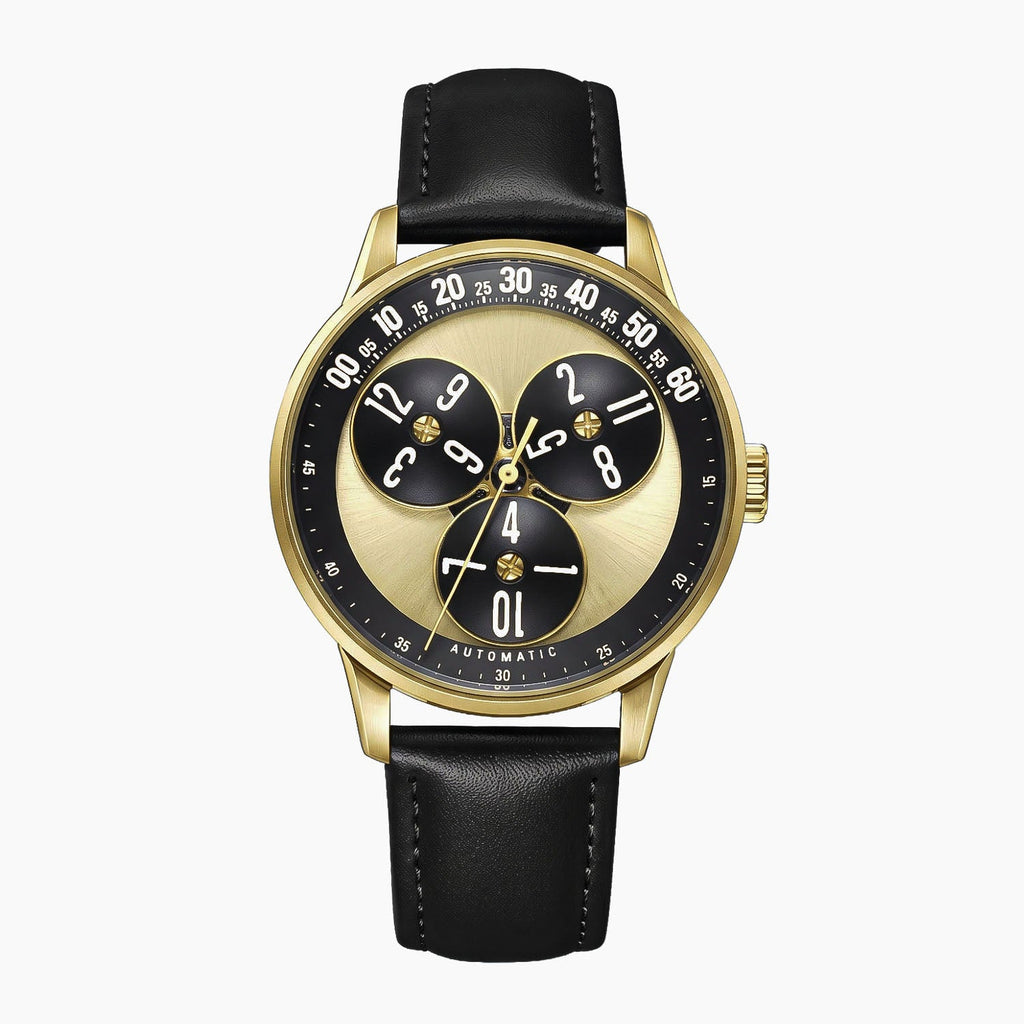 Mandetbrote Wandering Hour Gold — Front view of the gold and black dial with three rotating hour discs and arched minute track, 41.2mm gold-tone case on black leather strap, available at IFL Watches.