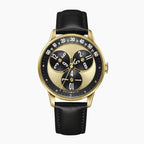 Mandetbrote Wandering Hour Gold — Front view of the gold and black dial with three rotating hour discs and arched minute track, 41.2mm gold-tone case on black leather strap, available at IFL Watches.