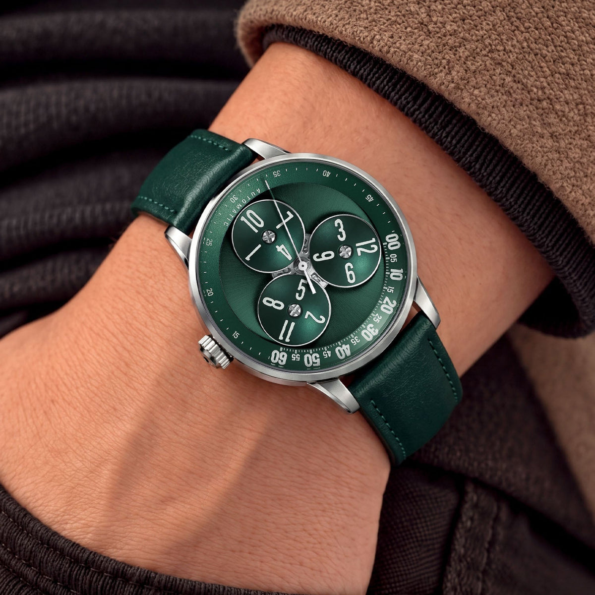 Mandetbrote Wandering Hour Green — Worn on wrist with a hand in pocket, seen from a relaxed angle, available at IFL Watches.