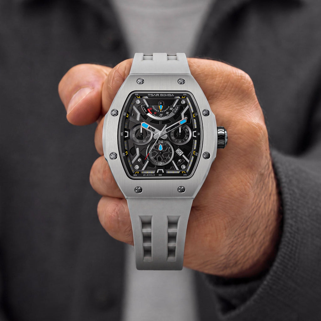 Tsar Bomba Atomic Ghost Grey — Held in hand, showing the open-worked dial and screwed bezel, available at IFL Watches.