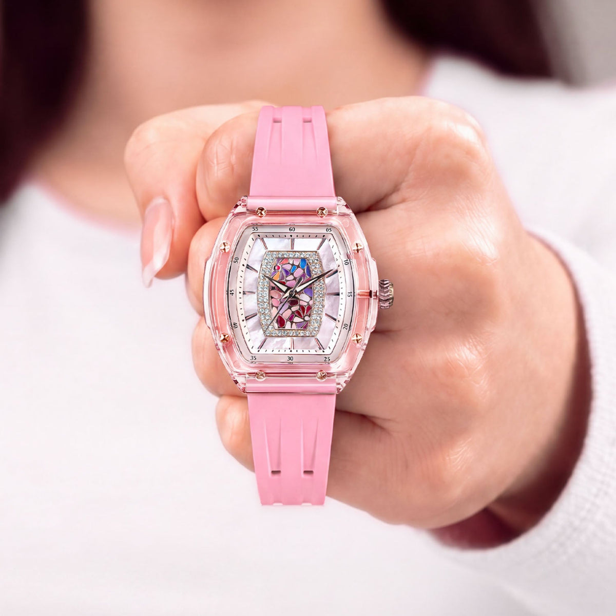 Tsar Bomba Nucleus Femme 02 Pink — Held in hand, showing the transparent case and rose-gold screws, available at IFL Watches.