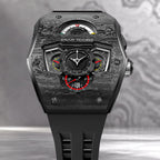 Tsar Bomba Parallax Carbon Black — Front close-up against a dark textured backdrop, showing the day, month and 24-hour displays, available at IFL Watches.