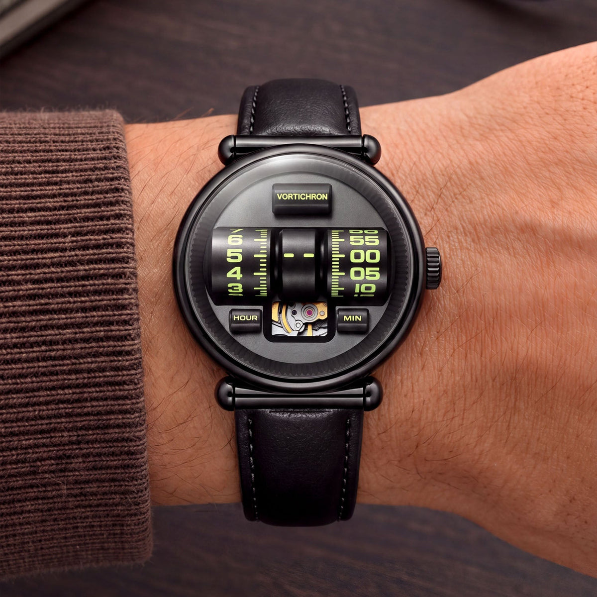 Vortichron Double Roller Midnight Black — Worn on wrist with a brown sleeve, showing the HOUR and MIN rollers, available at IFL Watches.