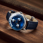 Vortichron Timeorb Blue — Lying on a wooden surface, showing the navy leather strap and steel folding clasp, available at IFL Watches.