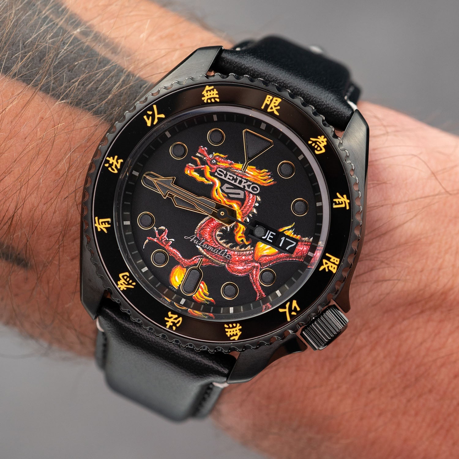 Custom Seiko 5 Sports 55th Anniversary Bruce Lee Limited Edition watch featuring hand-painted dragon design by IFL Watches, bespoke timepiece with black leather strap.