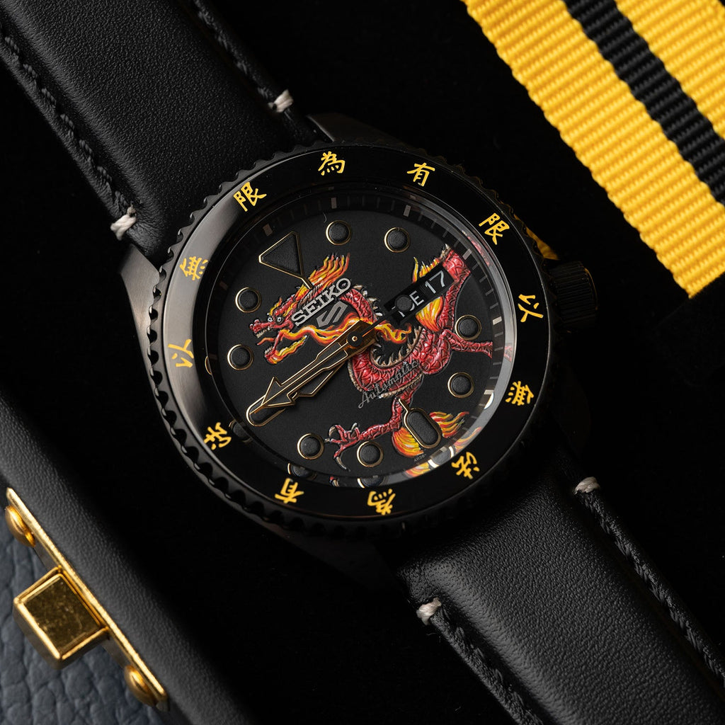 Custom Seiko 5 Sports 55th Anniversary Bruce Lee Limited Edition watch featuring hand-painted dragon design by IFL Watches, bespoke timepiece with black leather and yellow nylon straps.