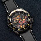 Custom Seiko 5 Sports 55th Anniversary Bruce Lee Limited Edition watch featuring hand-painted dragon design by IFL Watches, bespoke timepiece with black leather and yellow nylon straps.