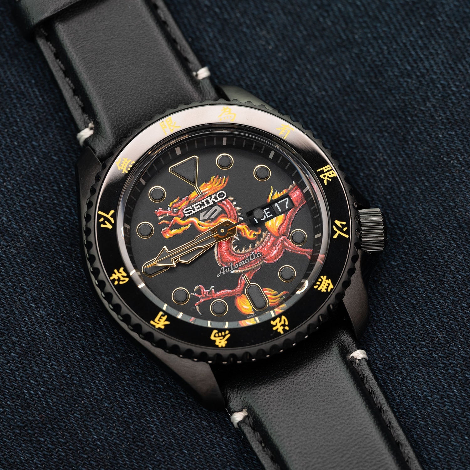 Custom Seiko 5 Sports 55th Anniversary Bruce Lee Limited Edition watch featuring hand-painted dragon design by IFL Watches, bespoke timepiece with black leather and yellow nylon straps.