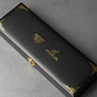 Commemorative box for Seiko 5 Sports 55th Anniversary Bruce Lee Limited Edition watch, featuring gold embossed logos of Seiko and Bruce Lee, with elegant black design and gold accents.