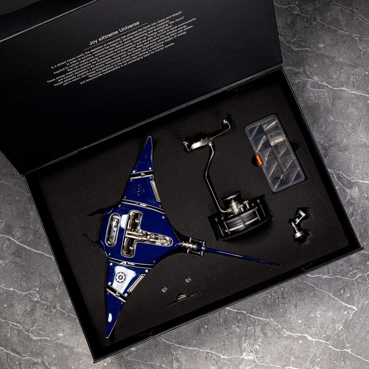 Mecha Ray Blue — the pre-assembled version in its presentation case with stand column and parts tray, motorised metal sculpture by IFL Watches.