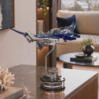 Mecha Ray Blue — the manta in motion on its stand on a marble side table, with close-ups of the gear train, sprung wing linkage and lacquered bodywork, kinetic metal sculpture by IFL Watches.