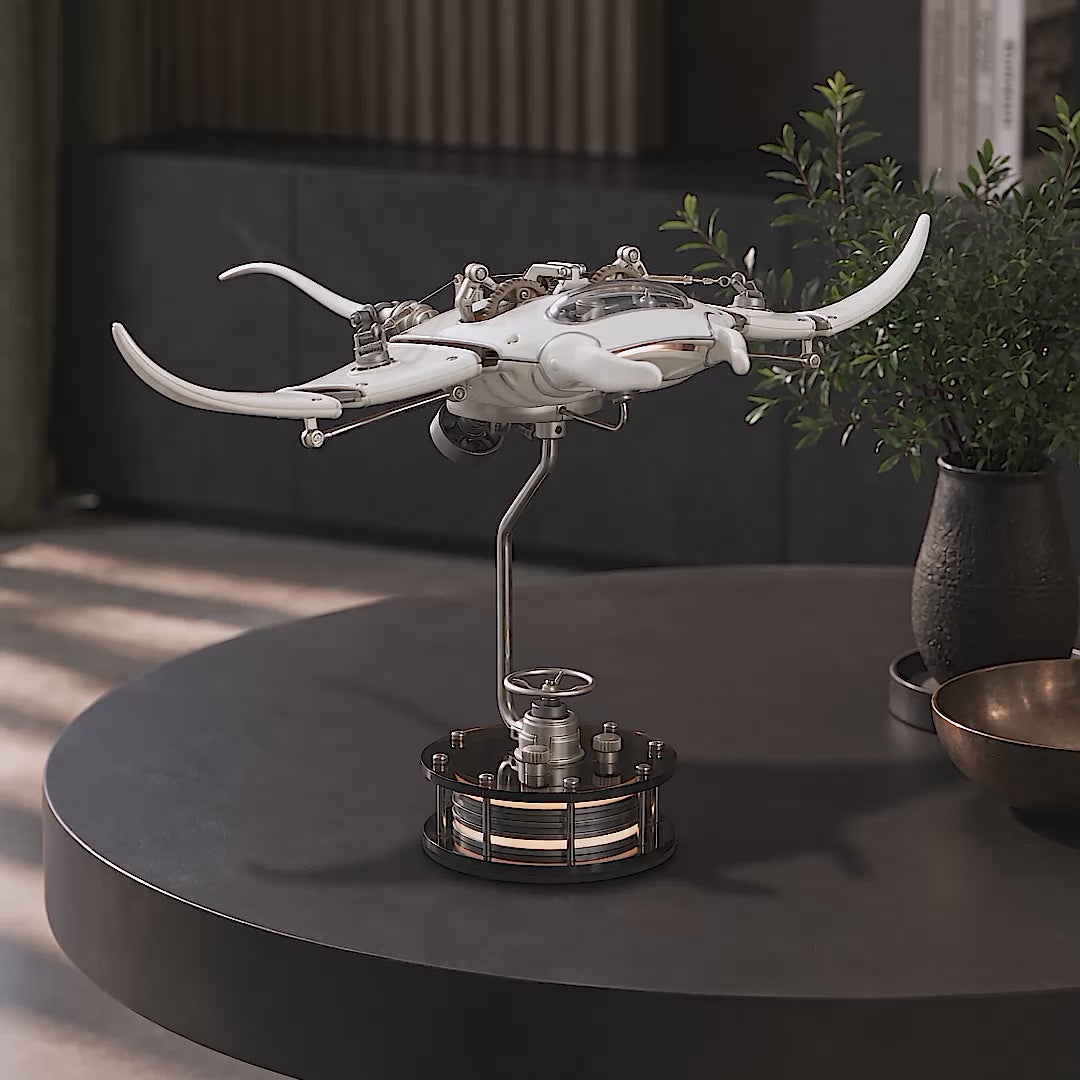 Mecha Ray White — the manta moving its wings on a dark round table, then closing in on the gears, the louvred wing panels and the sprung linkage, motorised metal sculpture by IFL Watches.